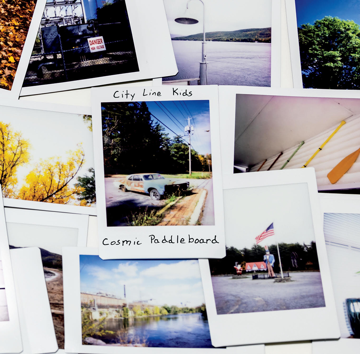 An album cover that has a bunch of instant photos from around the Upstate New York area.