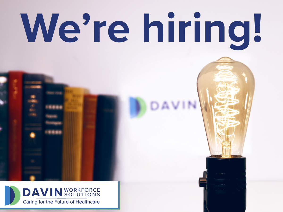 Large text saying, "We're hiring!" dominate the top third of the image. The rest is a lightbulb in front of books with the Davin Workforce Solutions logo.